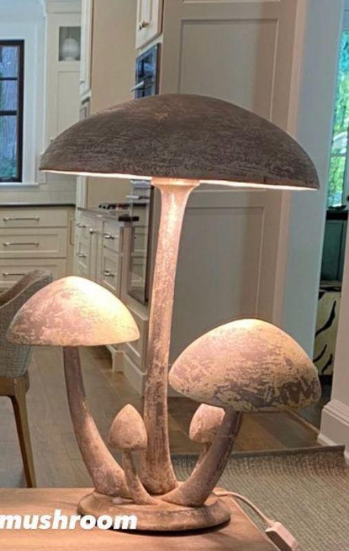 A rustic wooden floor lamp featuring a cluster of five organically tiered mushrooms with a textured brown finish.