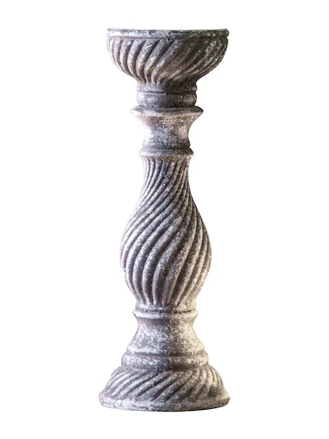 A rustic, grey candlestick holder featuring a distressed finish