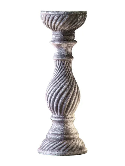 A rustic, grey candlestick holder featuring a distressed finish