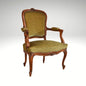 An antique French-style wooden accent chair featuring moss green velvet cushions and curved cabriole legs.
