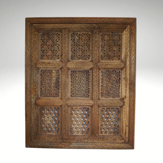 A hand-carved square wooden wall panel featuring a nine-grid design with intricate floral and geometric openwork lattices.