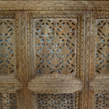 A hand-carved square wooden wall panel featuring a nine-grid design with intricate floral and geometric openwork lattices.