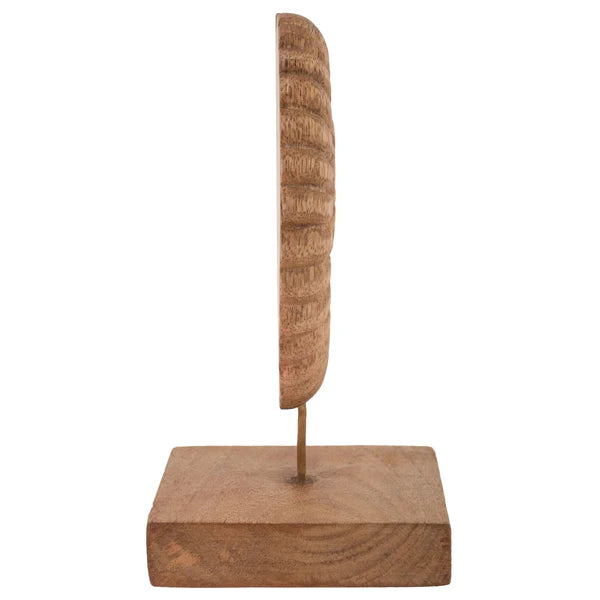 A decorative carved wooden nautilus shell sculpture mounted on a metal rod with a square wooden base.