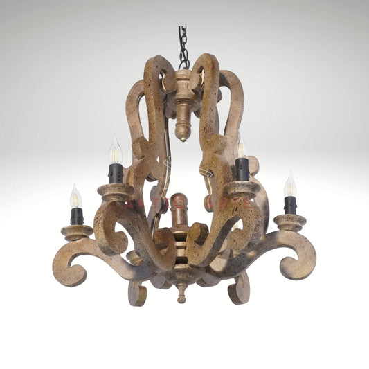 A rustic, vintage-style wooden chandelier with an intricate, open-scrollwork frame suspended by a dark metal chain