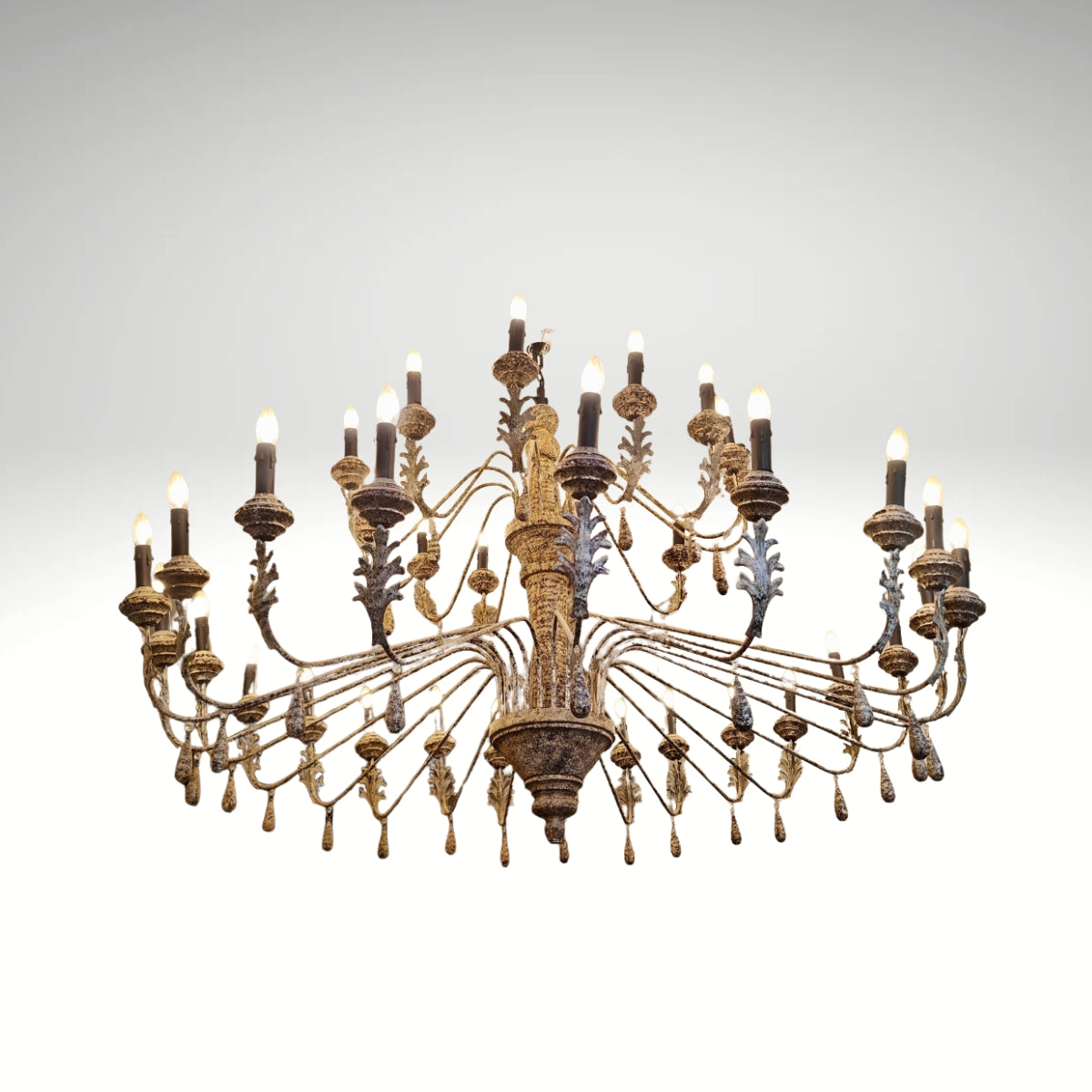 Large antique tiered candle chandelier with a Patine finish.