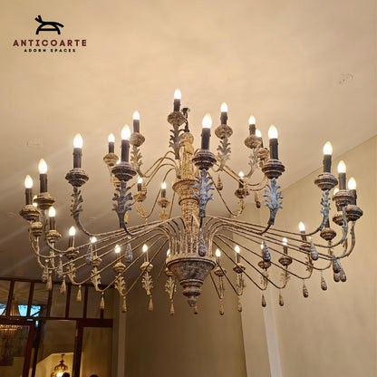 Large antique tiered candle chandelier with a Patine finish.