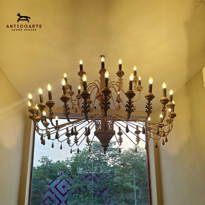 Large antique tiered candle chandelier with a Patine finish.