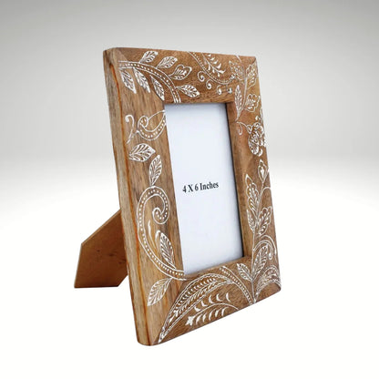 Handcrafted mango wood picture frame with intricate white floral