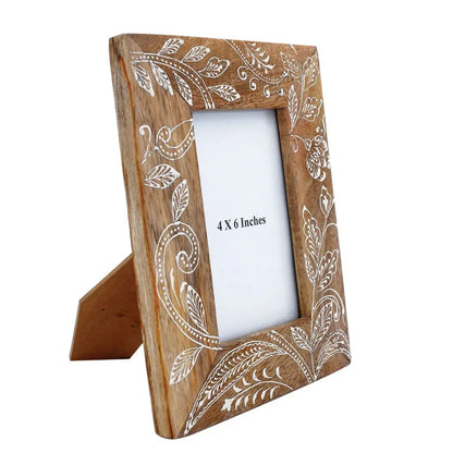 Handcrafted mango wood picture frame with intricate white floral