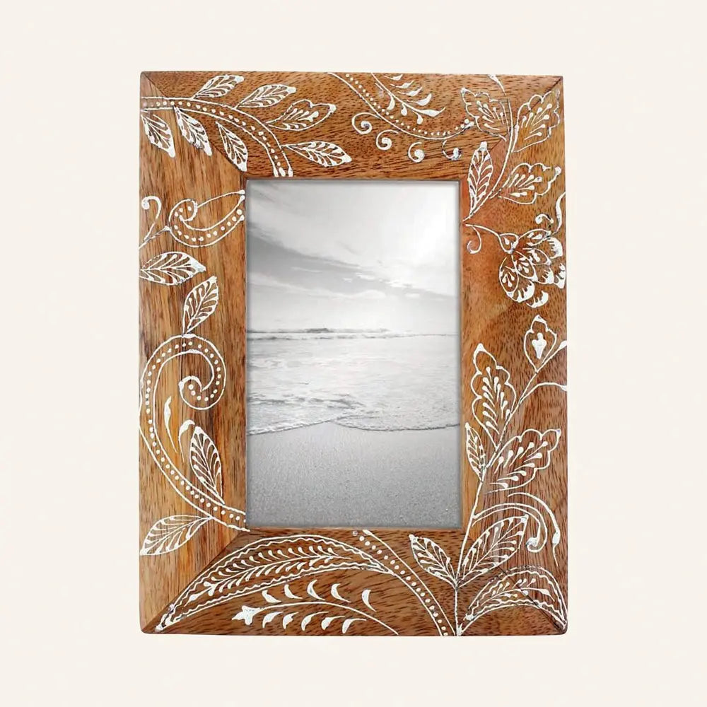 Handcrafted mango wood picture frame with intricate white floral