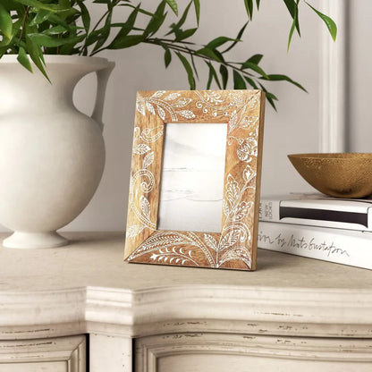 Handcrafted mango wood picture frame with intricate white floral