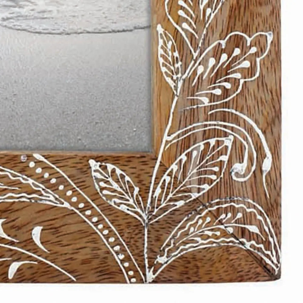 Handcrafted mango wood picture frame with intricate white floral
