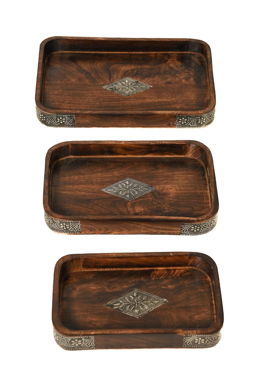 A stack of three rectangular dark brown wooden serving trays featuring ornate metal diamond inlays in the center and decorative metal borders along the corners.