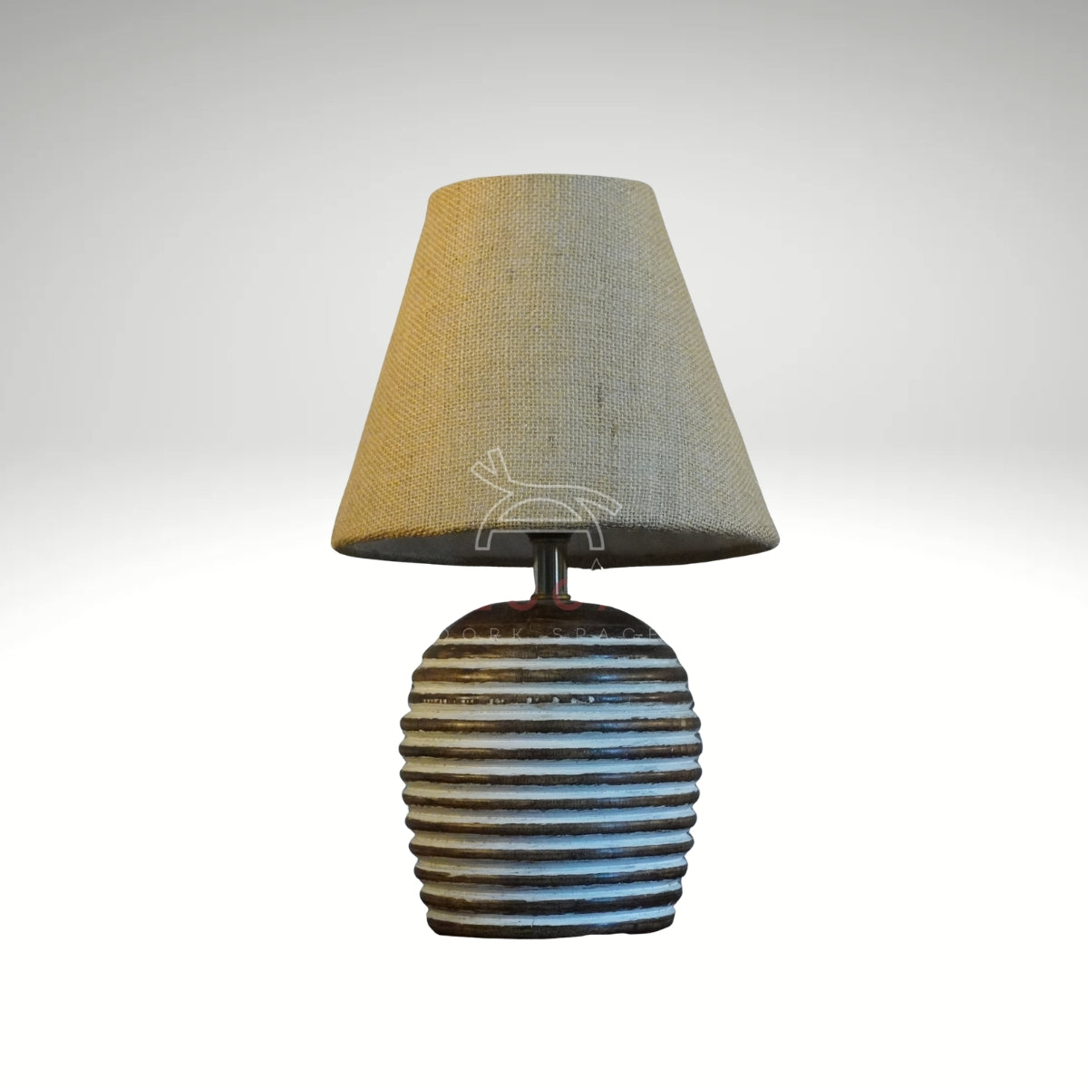 Rustic ribbed ceramic table lamp with a beige fabric shade