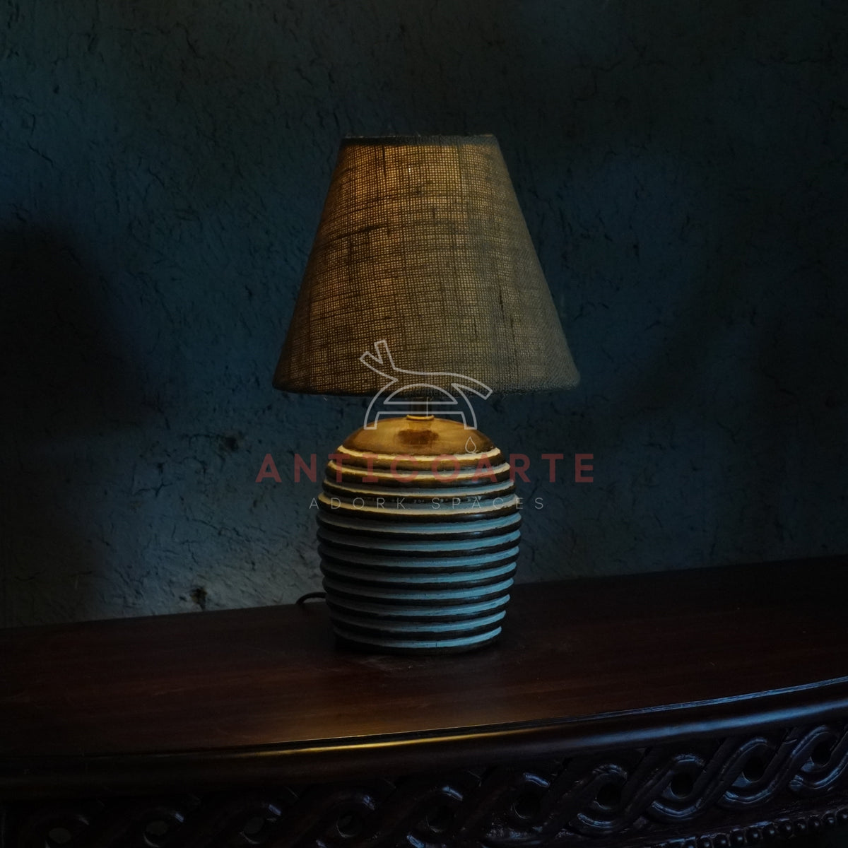 Rustic ribbed ceramic table lamp with a beige fabric shade