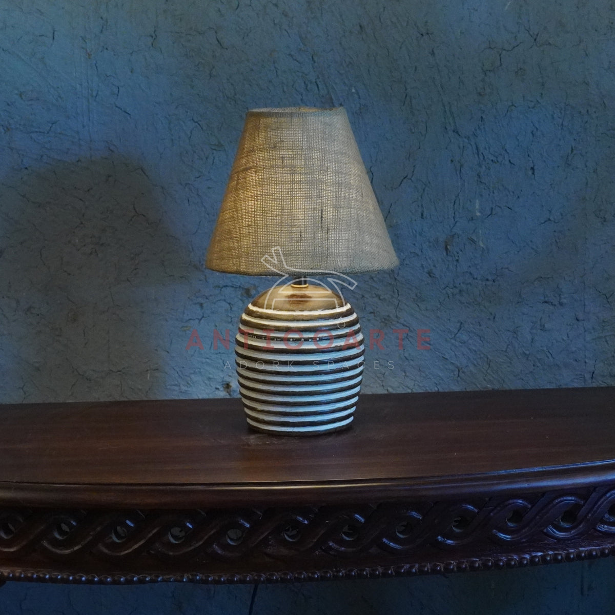 Rustic ribbed ceramic table lamp with a beige fabric shade
