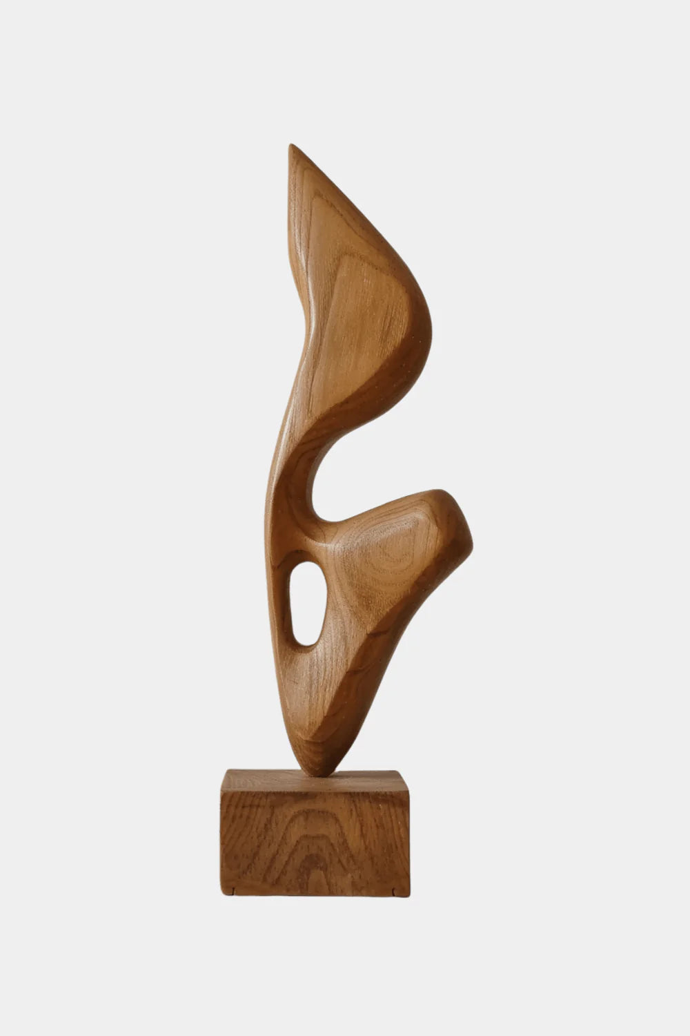 An abstract biomorphic wood sculpture with smooth curves and a hollow cutout, mounted on a square wooden base.