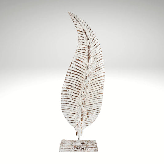  Distressed white metal leaf statue with rustic brown accents mounted on a stand.