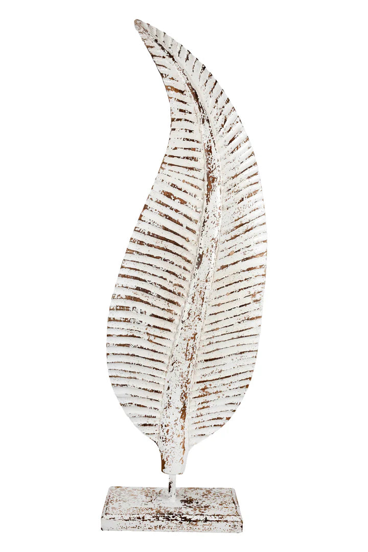  Distressed white metal leaf statue with rustic brown accents mounted on a stand.