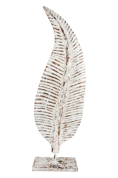  Distressed white metal leaf statue with rustic brown accents mounted on a stand.