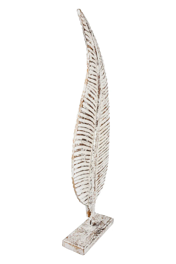  Distressed white metal leaf statue with rustic brown accents mounted on a stand.