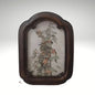 A vintage arched dark wood picture frame