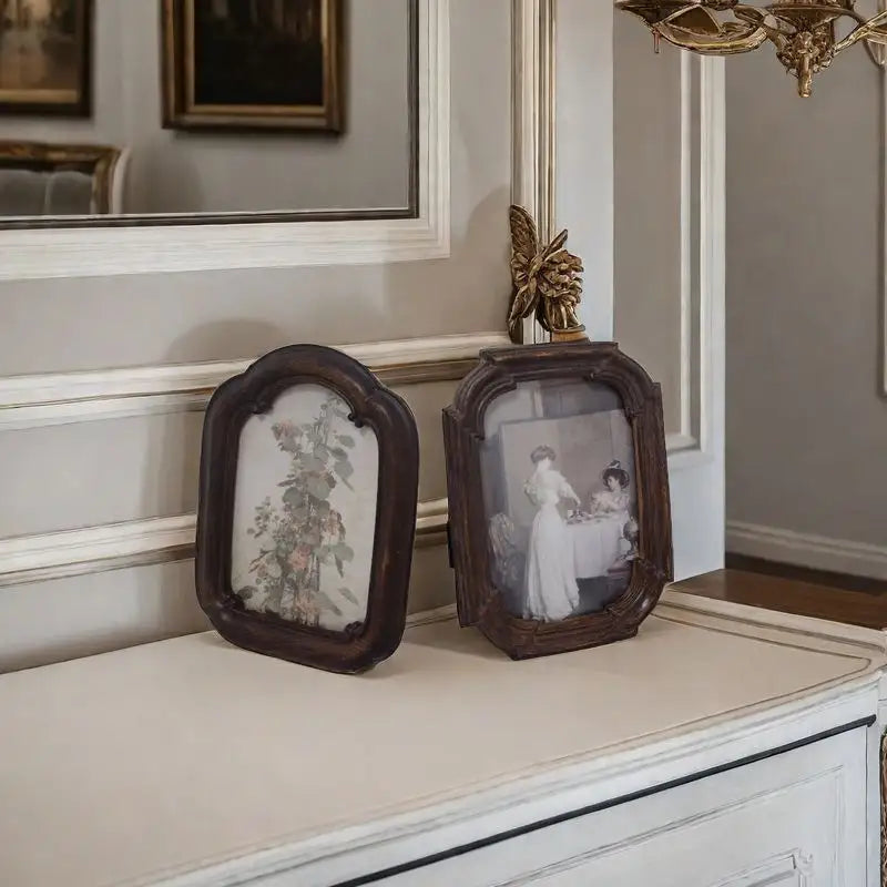 A vintage arched dark wood picture frame