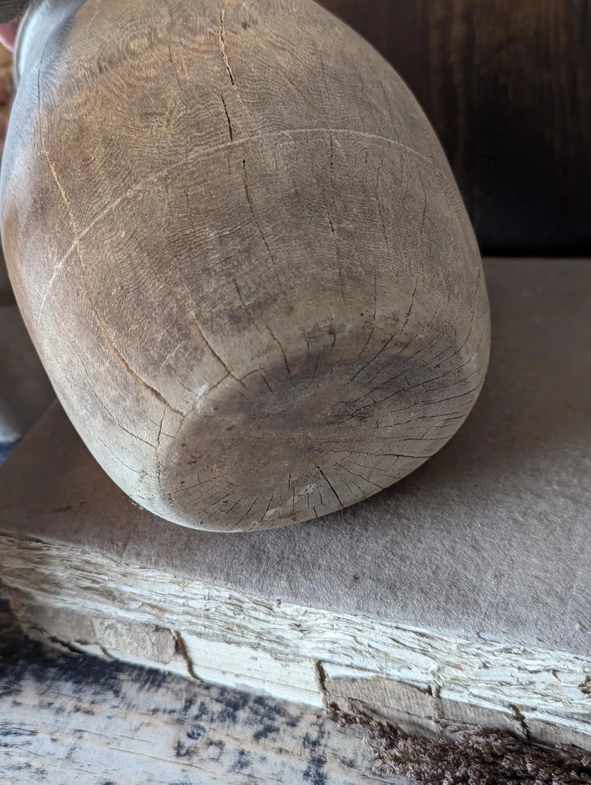 A vintage barrel-shaped carved wooden vessel 