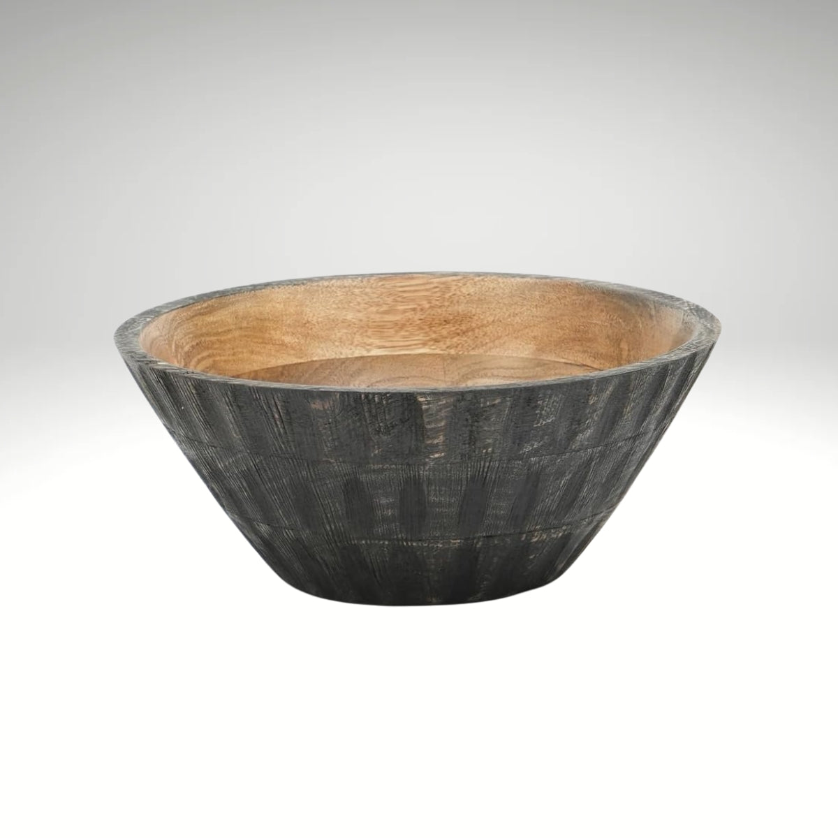 A round wooden bowl with a natural light brown wood interior and a textured, dark charcoal-grey ribbed exterior.