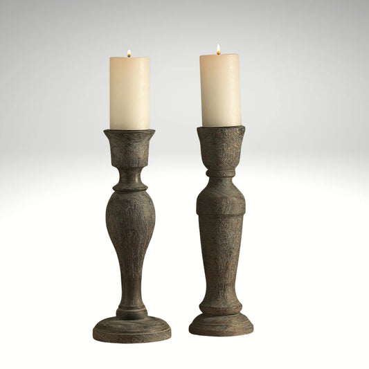 A pair of vintage-style distressed grey wooden candlestick holders