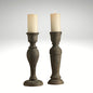 A pair of vintage-style distressed grey wooden candlestick holders