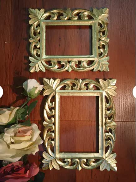 Two ornate gold-carved wooden picture frames