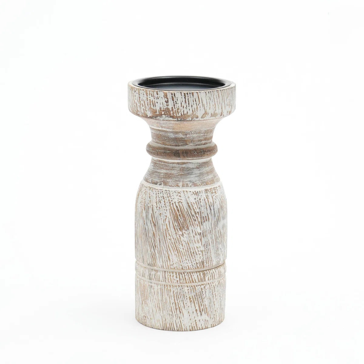 A rustic whitewashed wooden pillar candle holder with a distressed finish