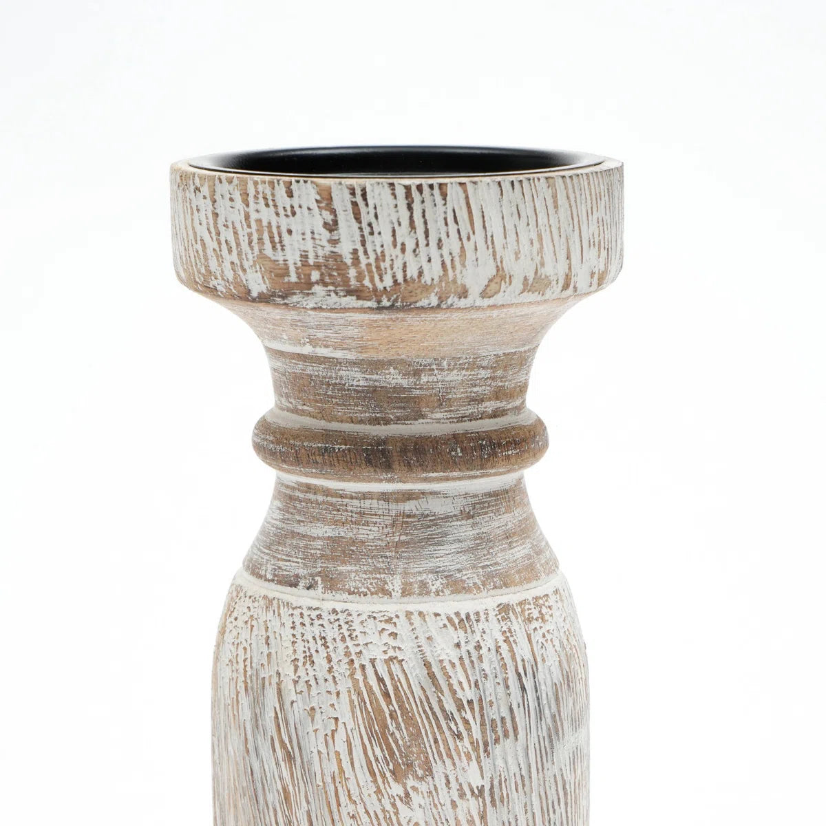 A rustic whitewashed wooden pillar candle holder with a distressed finish