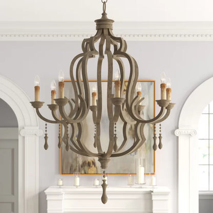 Rustic brown eight-light chandelier with an ornate scrolled frame and hanging wooden droplet accents.