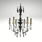 Rustic gothic-inspired wrought iron chandelier featuring carved details and flame-tip lights.