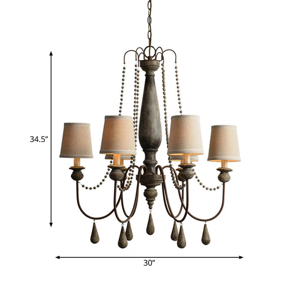 Rustic 6-light distressed wood chandelier with beige fabric shades and decorative beads.