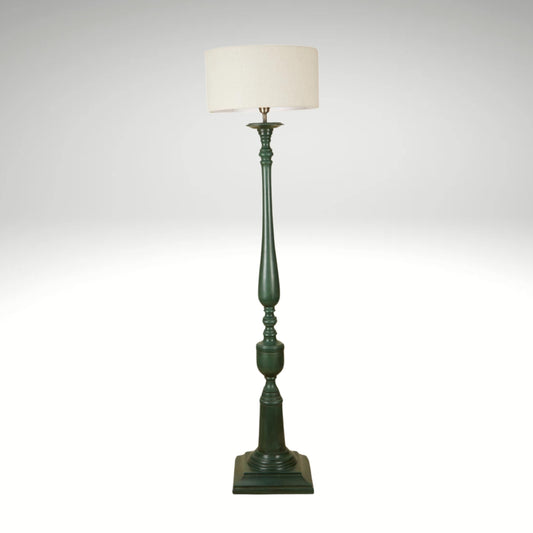 A classic forest green wooden floor lamp with an ornate carved pillar base and neutral shade.
