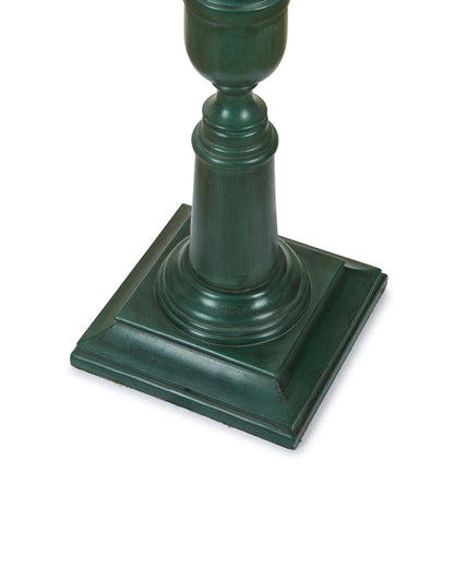 A classic forest green wooden floor lamp with an ornate carved pillar base and neutral shade.