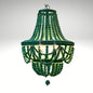 An empire-style chandelier crafted from vibrant green wooden beads.
