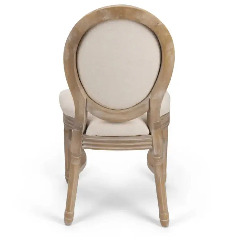 A rustic French country dining chair featuring an oval upholstered backrest and a weathered wooden frame.