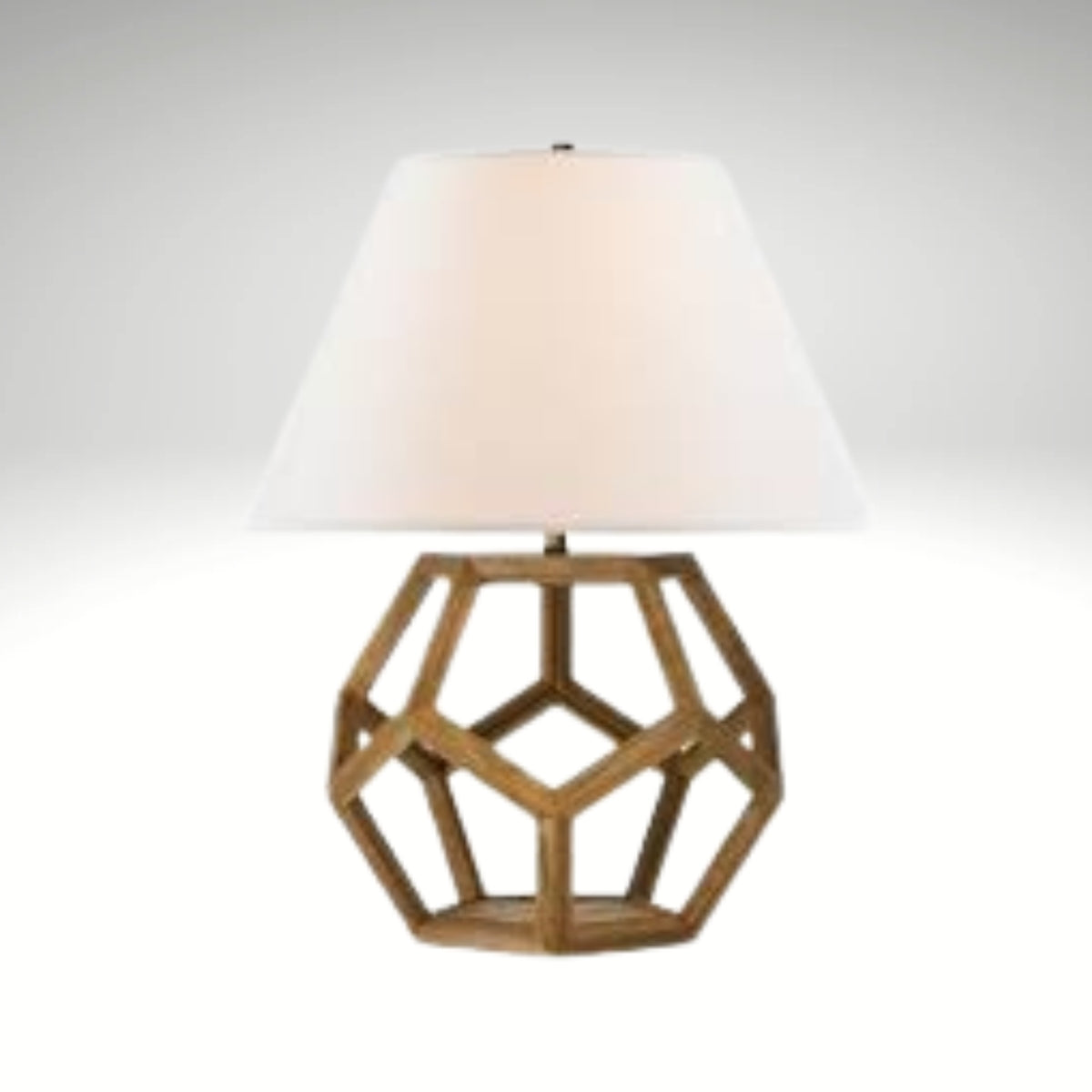 Side table lamp featuring a hollow hexagonal wood frame base and a white empire shade.