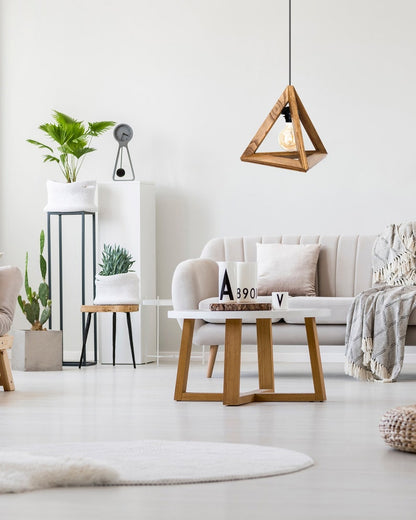 A minimalist pyramid-shaped wooden hanging lamp with a warm glowing light bulb.