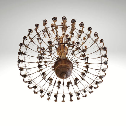 An antique bronze finish round chandelier featuring detailed leaf patterns, multiple small light bulbs, and a radial cage design.