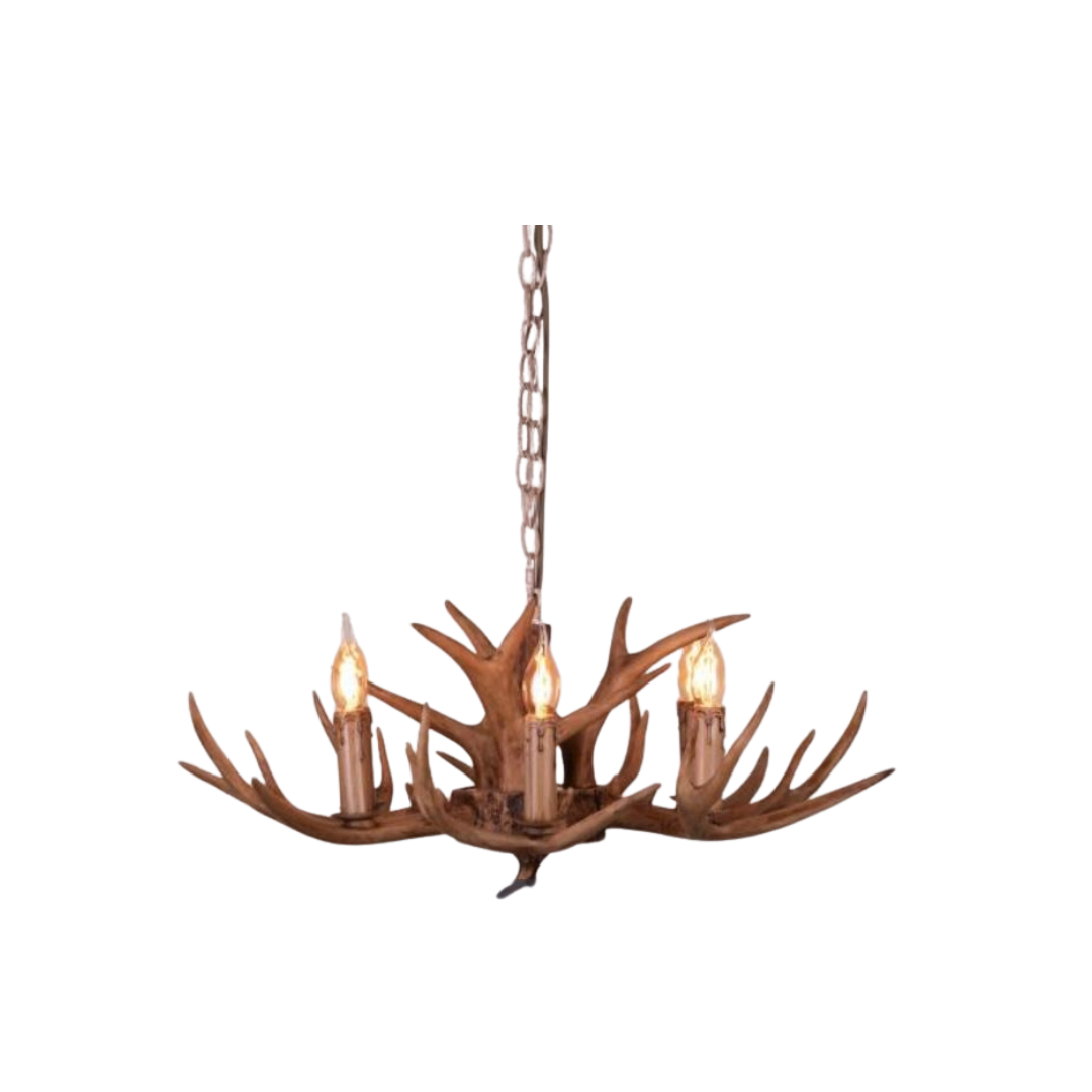 Faux antler pendant light with three lit candle-style bulbs, country style design.
