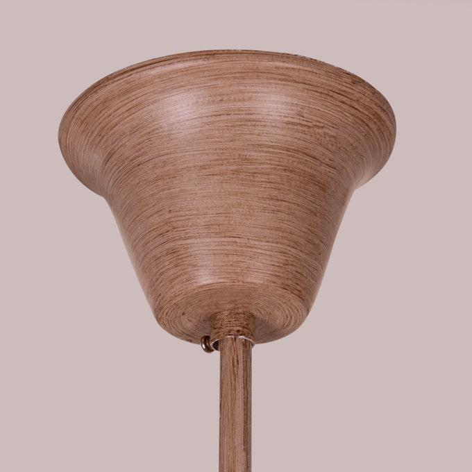 Faux antler pendant light with three lit candle-style bulbs, country style design.