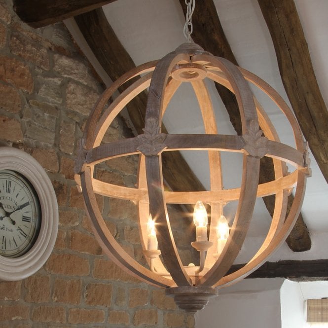 A 5-light orb chandelier featuring weathered gray wood rings and matte black metal hardware.