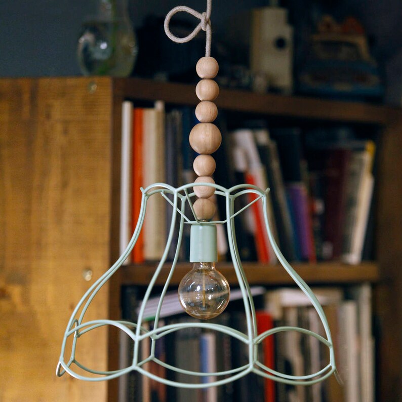 A rustic semi-flush mount ceiling light with a textured dome shade and a glowing bulb.