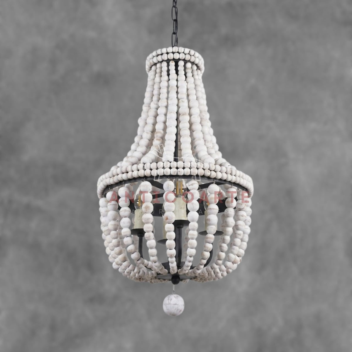 Elegant empire chandelier made with layers of distressed white wood beads and a black metal frame