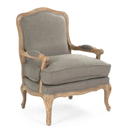 A classic French country style armchair with a weathered natural wood frame and comfortable grey linen upholstered cushions.